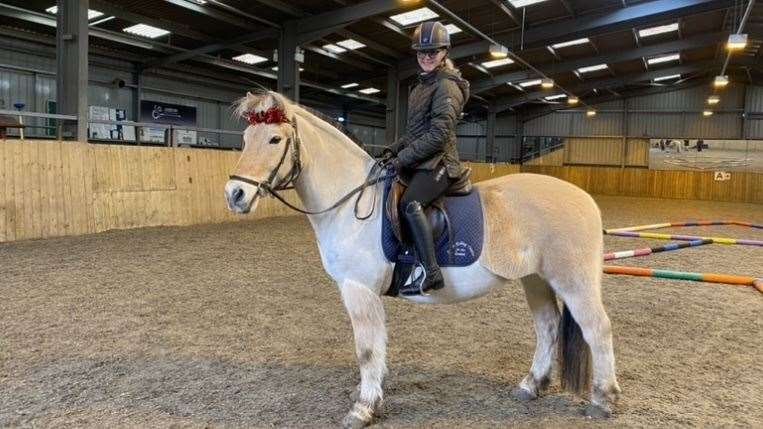 Ella Bennett during one of her riding lessons
