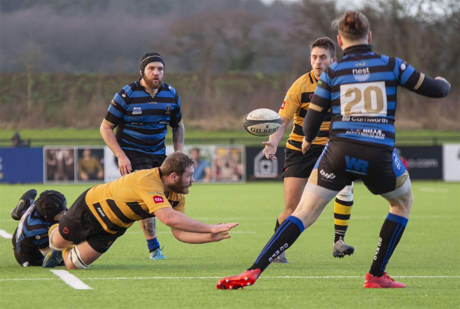 Tyler Oliver offloads to Canterbury team-mate Will Waddington. Picture: Phillipa Hilton