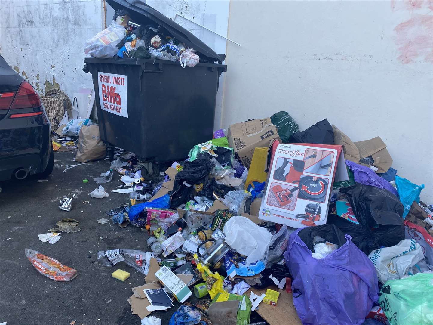 The rubbish appears to be a mix of household waste and fly-tipping