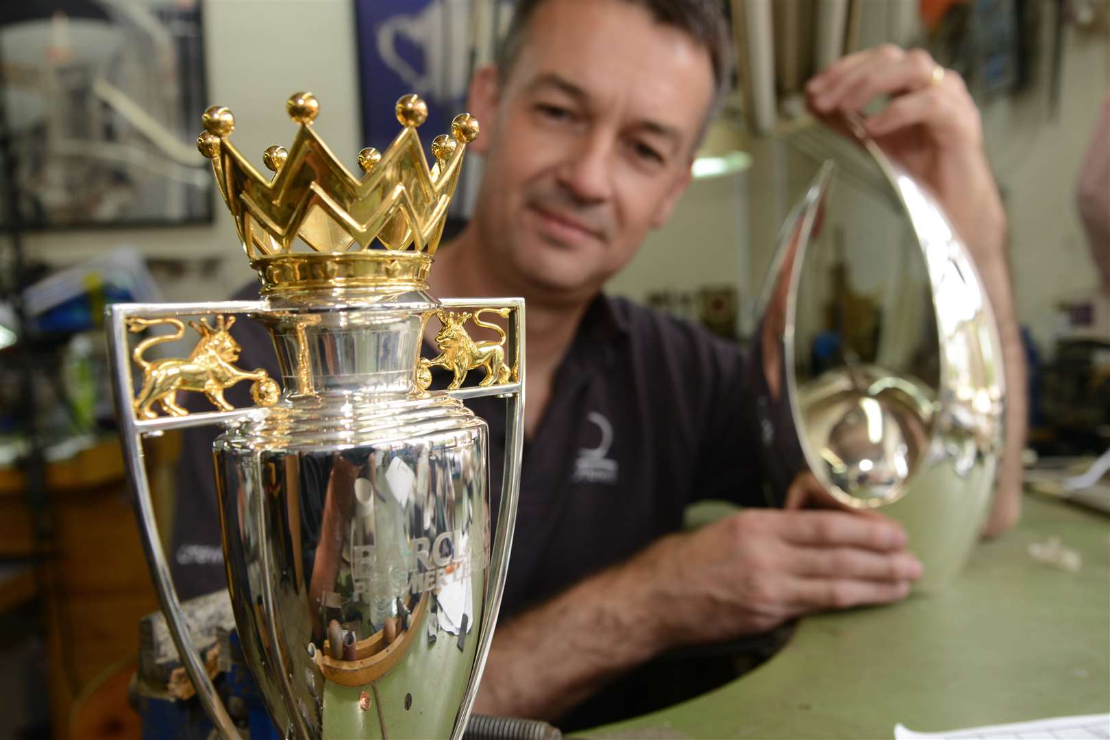 Steve Ottewill and a miniature version of the Premier League trophy