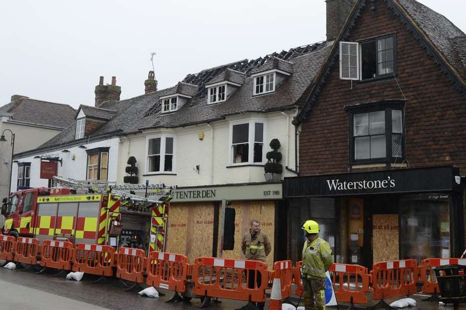 Firefighters in Tenterden in the aftermath of the blaze. Picture: Gary Browne