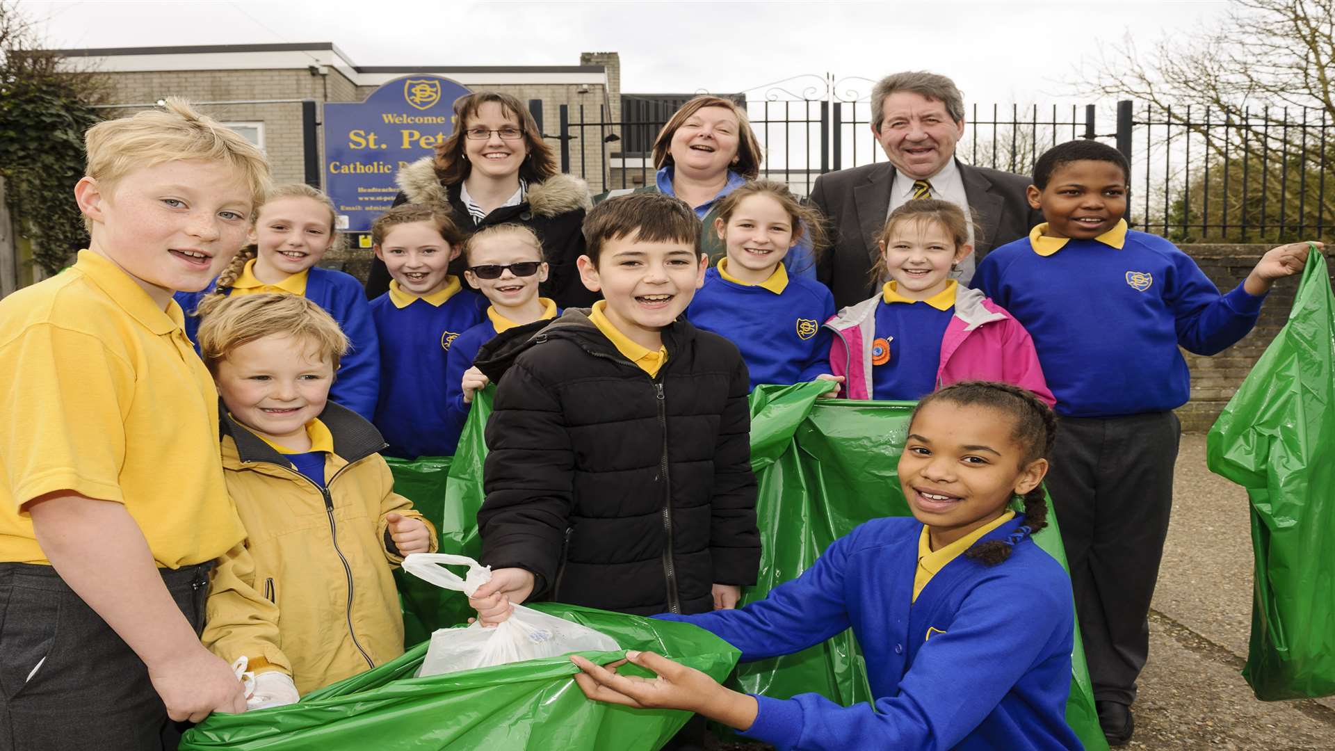 Headteacher Colleen Owen, back centre, with Jess McMahon, left, and Gordon Henderson MP of Litter Angels, with pupils from the school. Launch of the litter walk, in aid of the Litter Angels charity, at St Peters RC Primary School, West Ridge, Sittingbourne.