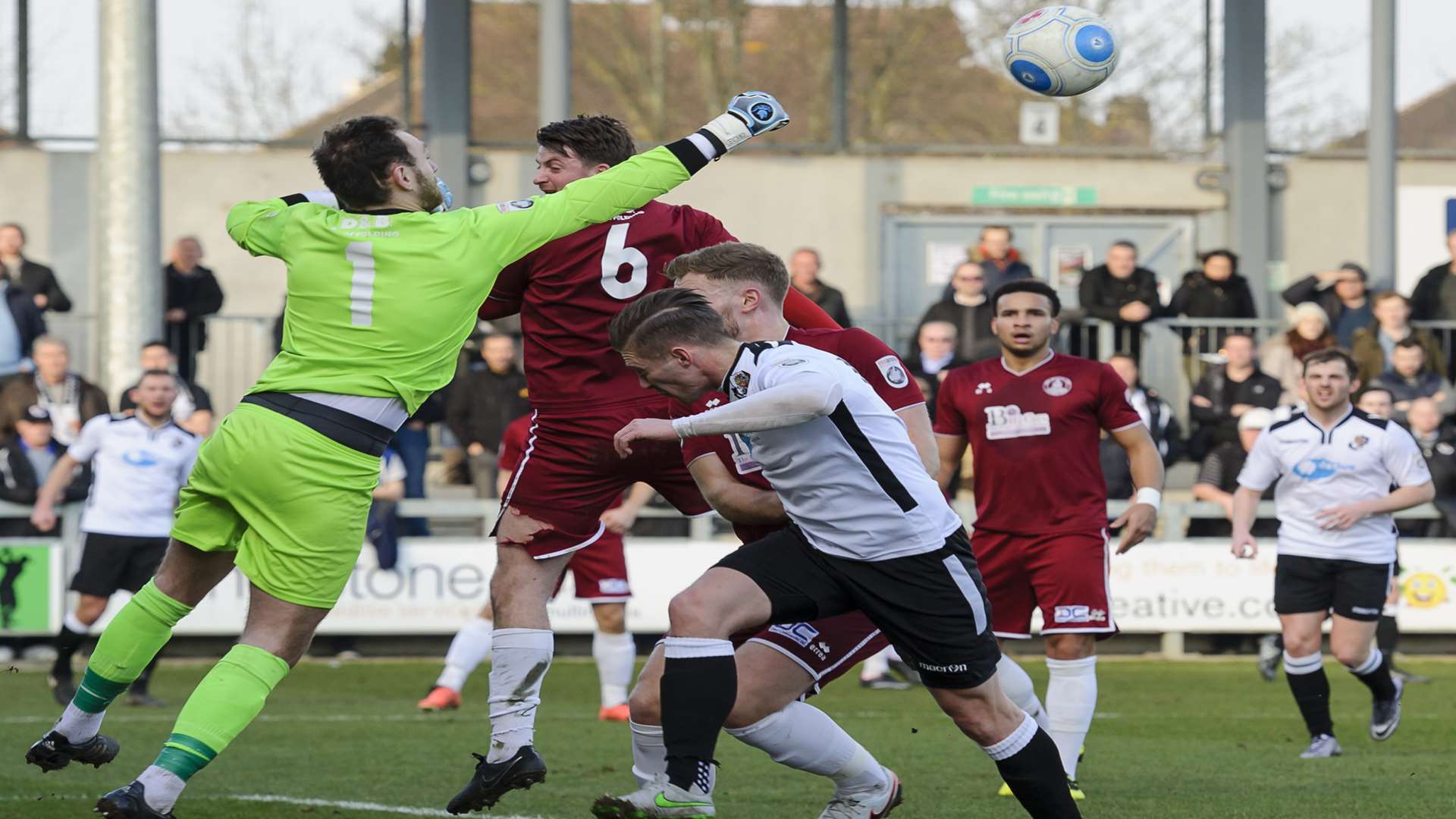 Keeper Ross Fitzsimons punches clear for Chelmsford as Dartford's Andy Pugh closes in. Picture: Andy Payton