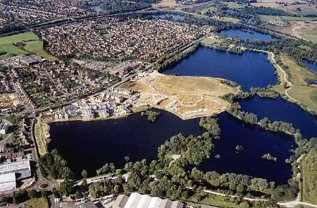 The new report says the infrastructure costs of developments such as this one at Leybourne Lakes will be huge. Picture: MIKE MAHONEY