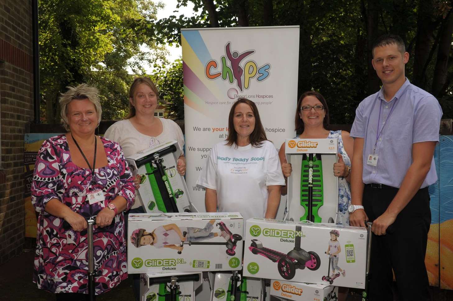 Scooters were donated to EllenorLions' chYps, with Tracie Dempster (Chyps), Jane Brennan, Sarah Johnson, Suzanne Moorcroft and Phillip Dickman (Chyps).
