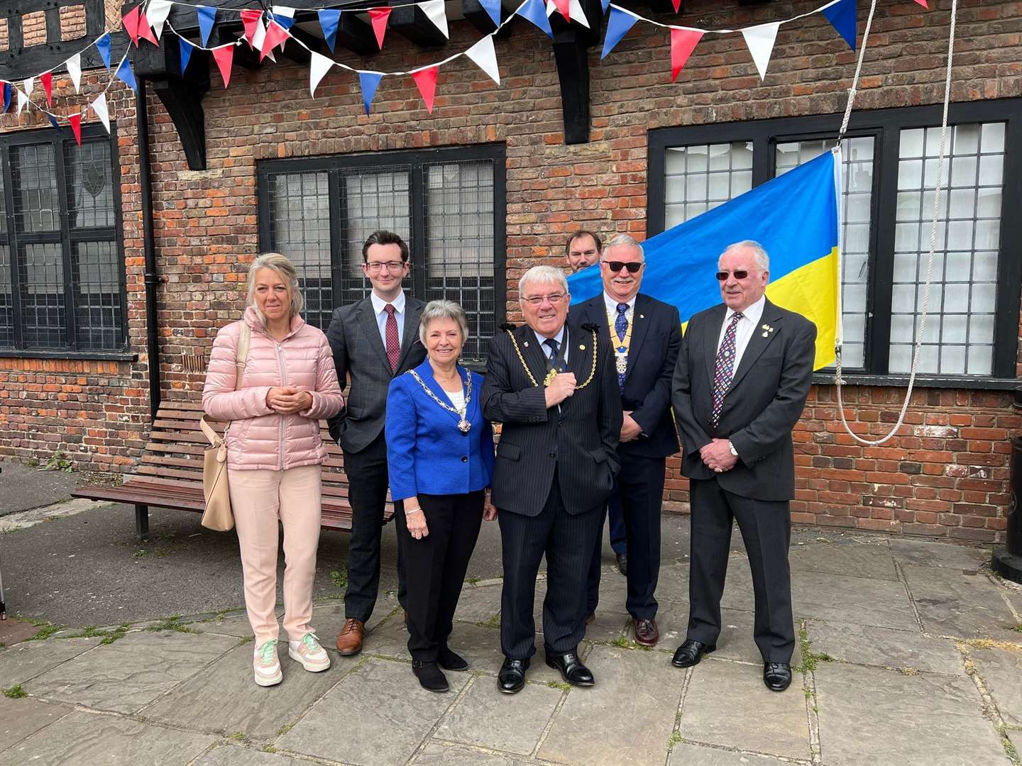 Councillors and Rotary members gathered for a flag raising ceremony on Sandwich Guildhall Forecourt