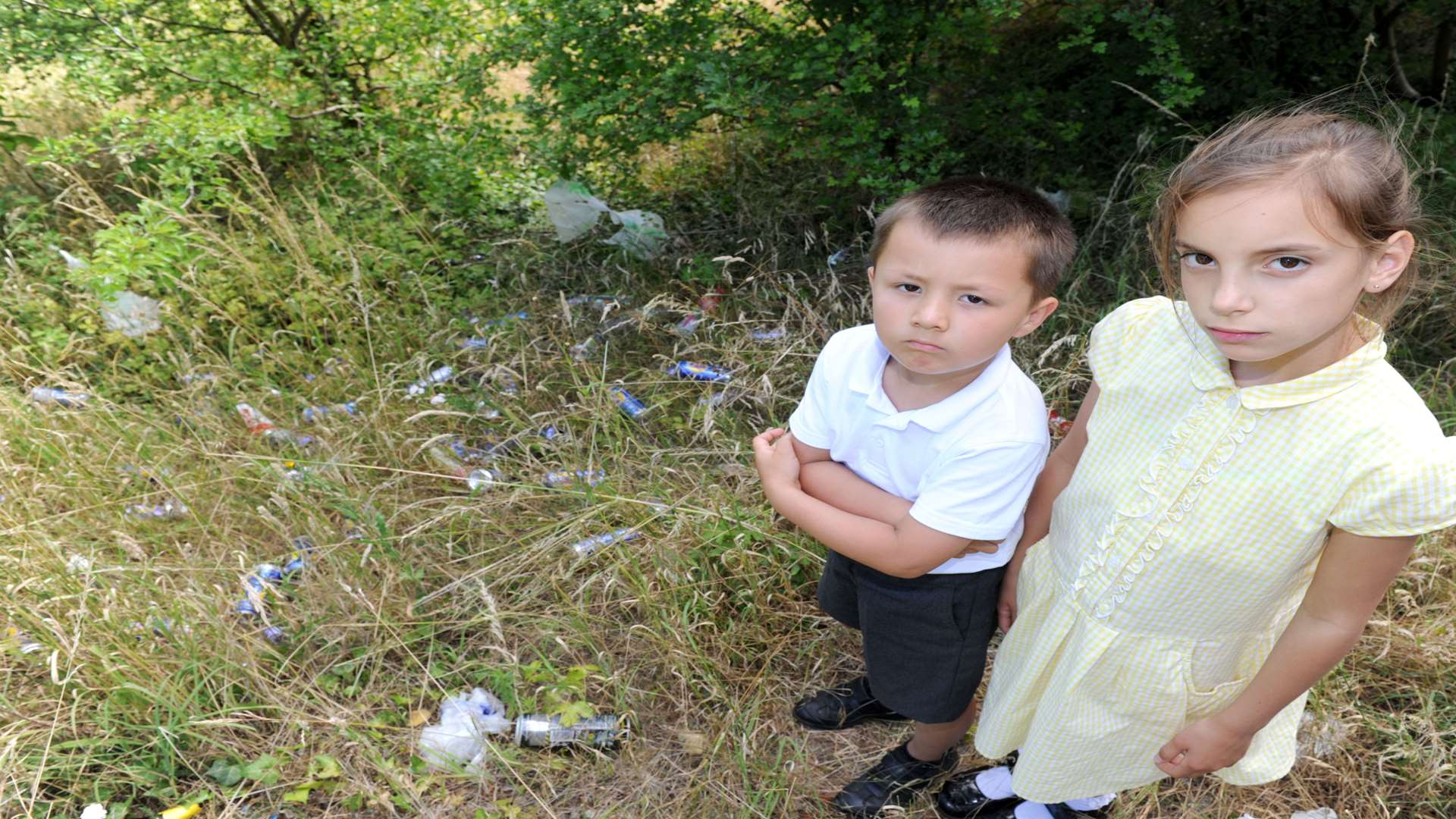 Ali Varamkova, five, and Sofia, 9, with some of the rubbish. Picture: Simon Hildrew
