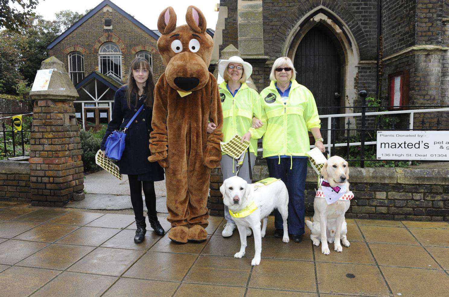 Thirteen year old Chloe Hayes, Scooby Dude, Liz Sykes, Patricia Poole, Ulla and Zebedee at Guide Dogs' autumn fair