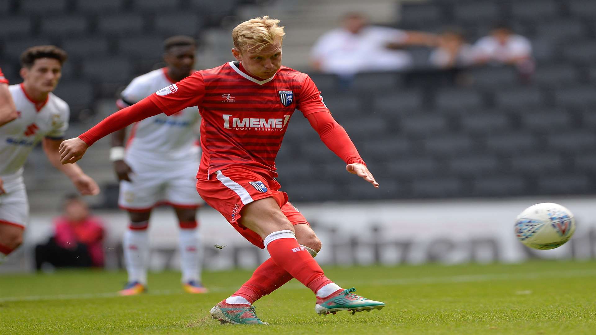 Gillingham's Josh Wright blazes his penalty over the bar at MK Dons. Picture: Ady Kerry