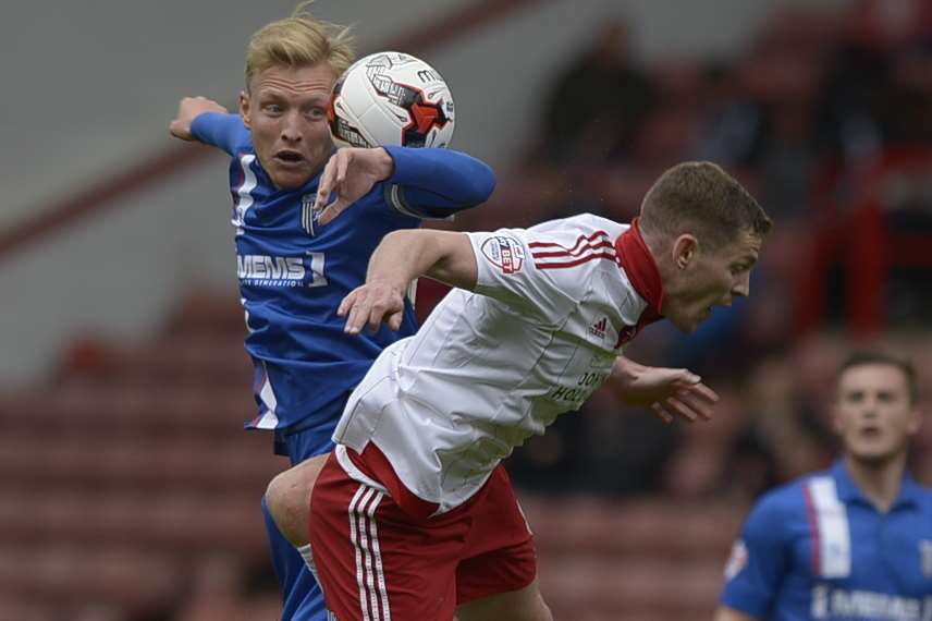 Gills skipper Josh Wright in aerial combat at Bramall Lane Picture: Barry Goodwin