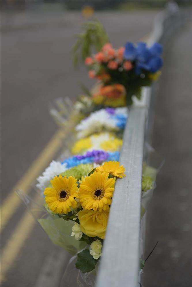 Floral tributes at the junction of Medway Road and Pier Road, where a cyclist was struck by a lorry