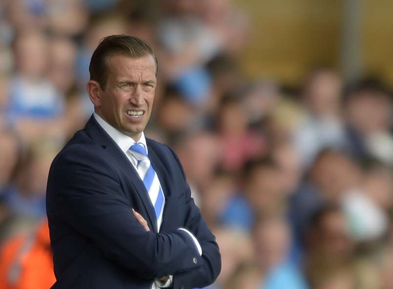Gills manager Justin Edinburgh watches from the sidelines on Saturday Picture: Barry Goodwin