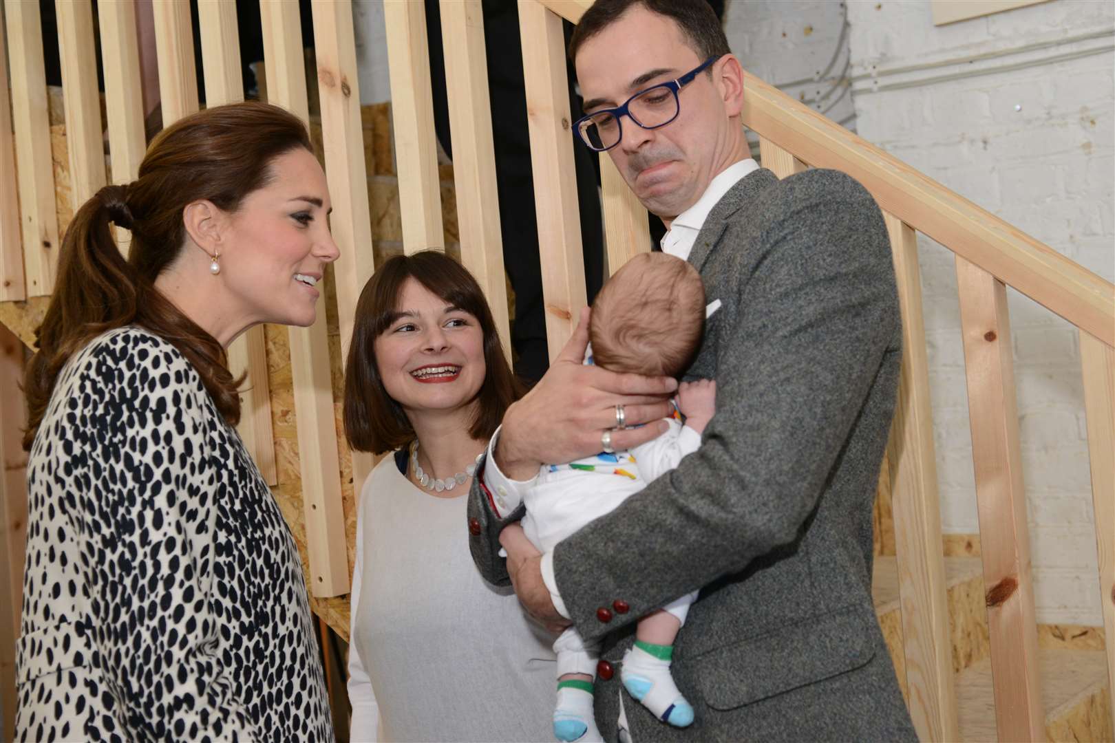 Kate meeting architect Tamsin Landells, her husband Tim Ratliff and their six-week-old son Evan