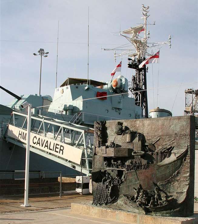 HMS Cavalier and the bronze monument at Chatham's Historic Dockyard by it forms the National Destroyer memorial. Copyright: Gail James