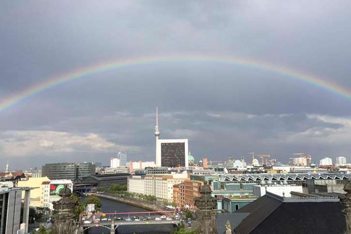 A rainbow frames the city view. This was taken from the top of the Reichstag's Dome