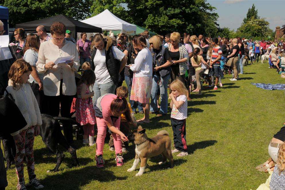 The queue for registration at Higham Memorial Field in School Lane