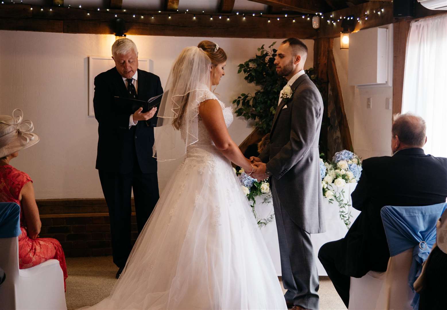 Twinkling fairy lights, lit up the room as Holly and Stan said their I dos