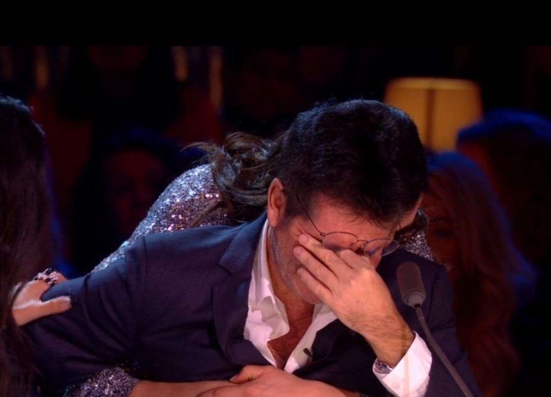 Simon Cowell broke down on the X Factor final after watching the performance. Pic: ITV (23130813)