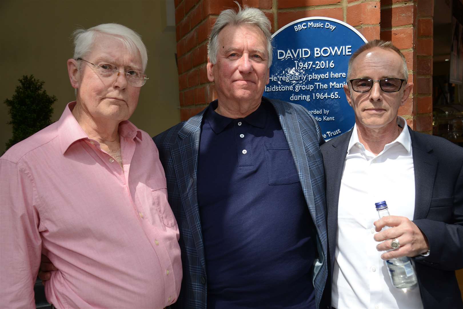 Manish Boys band members Woof Byrne, Bob Solly with Topper Headon, former drummer with The Clash and the plaque