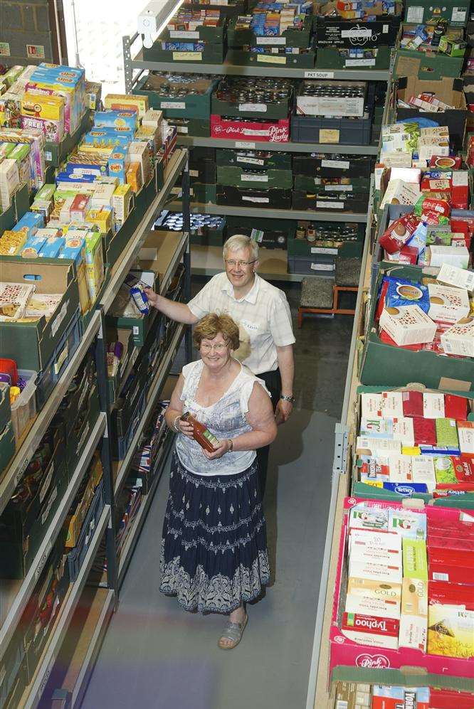 Warehouse manager Kevin Jennings and volunteer Sandra Wyatt