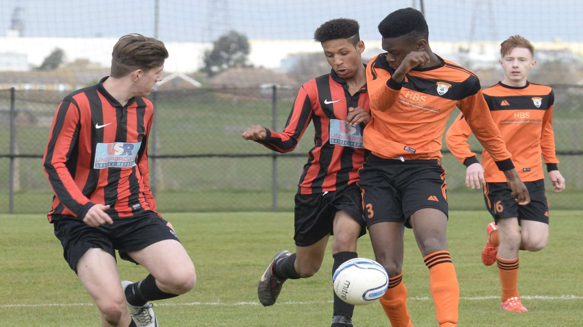 Lordswood Youth under-16s, in orange, battle Meopham Colts in the Medway Messenger Youth League's League Cup final Picture: Chris Davey