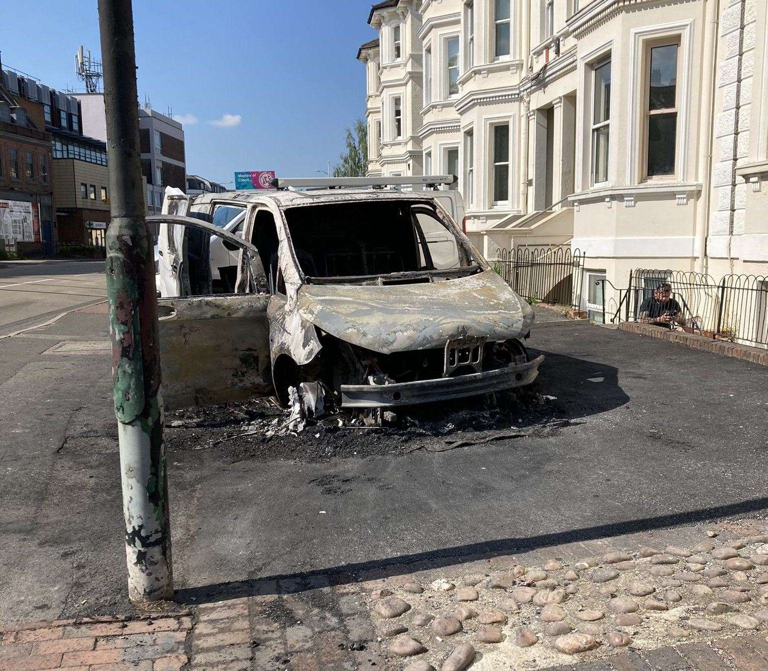 The burnt out van in St John's Road. Picture: @Monkex on Twitter