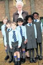 Young pupils with retiring head Anita Parkins