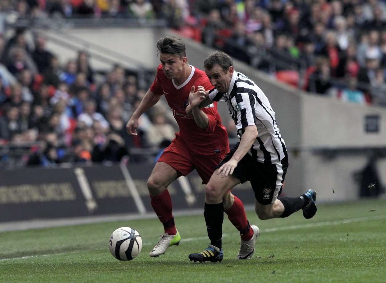 Jon Pilbeam (red) playing in the 2013 FA Vase final at Wembley Picture: Barry Goodwin