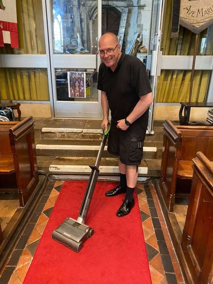 Father Robert Lane tackles the carpets