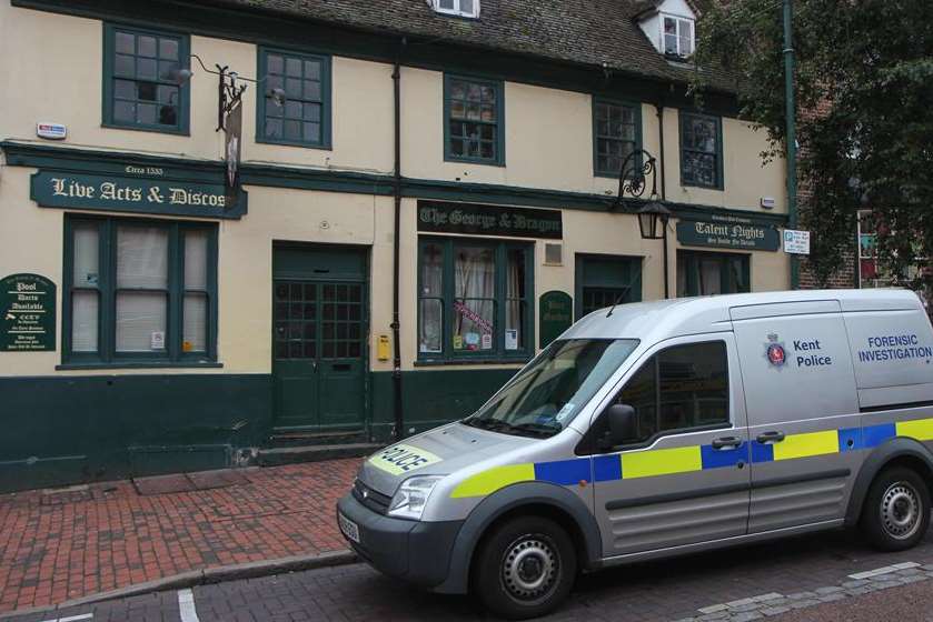 A police forensics team van outside The George and Dragon pub in Sittingbourne High Street