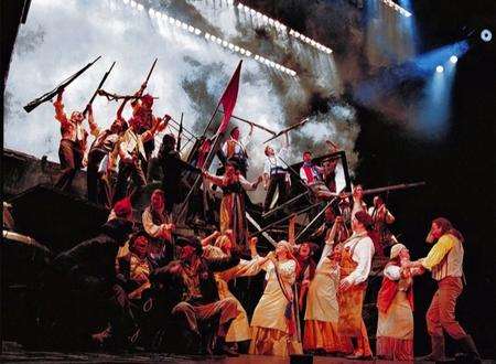 A cast scene from the stage show Les Miserables at The Shaftesbury Theatre, London