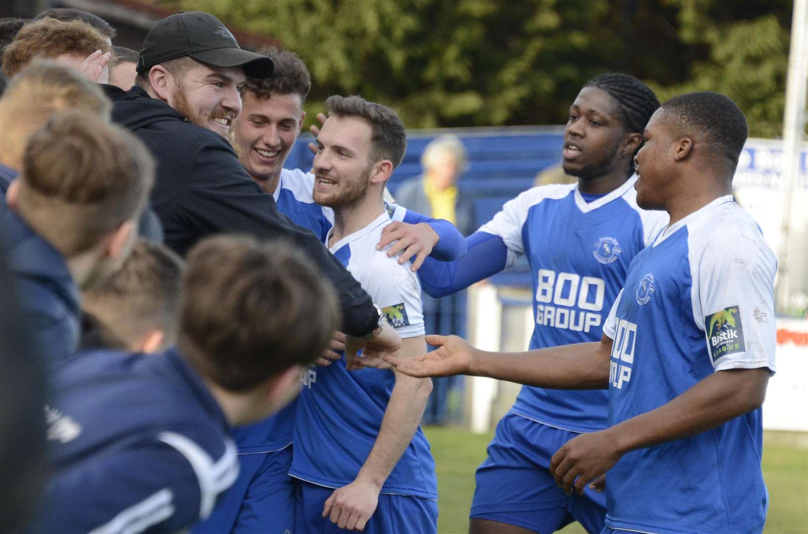 Herne Bay's players celebrate their second goal against Whitstable with fans Picture: Paul Amos