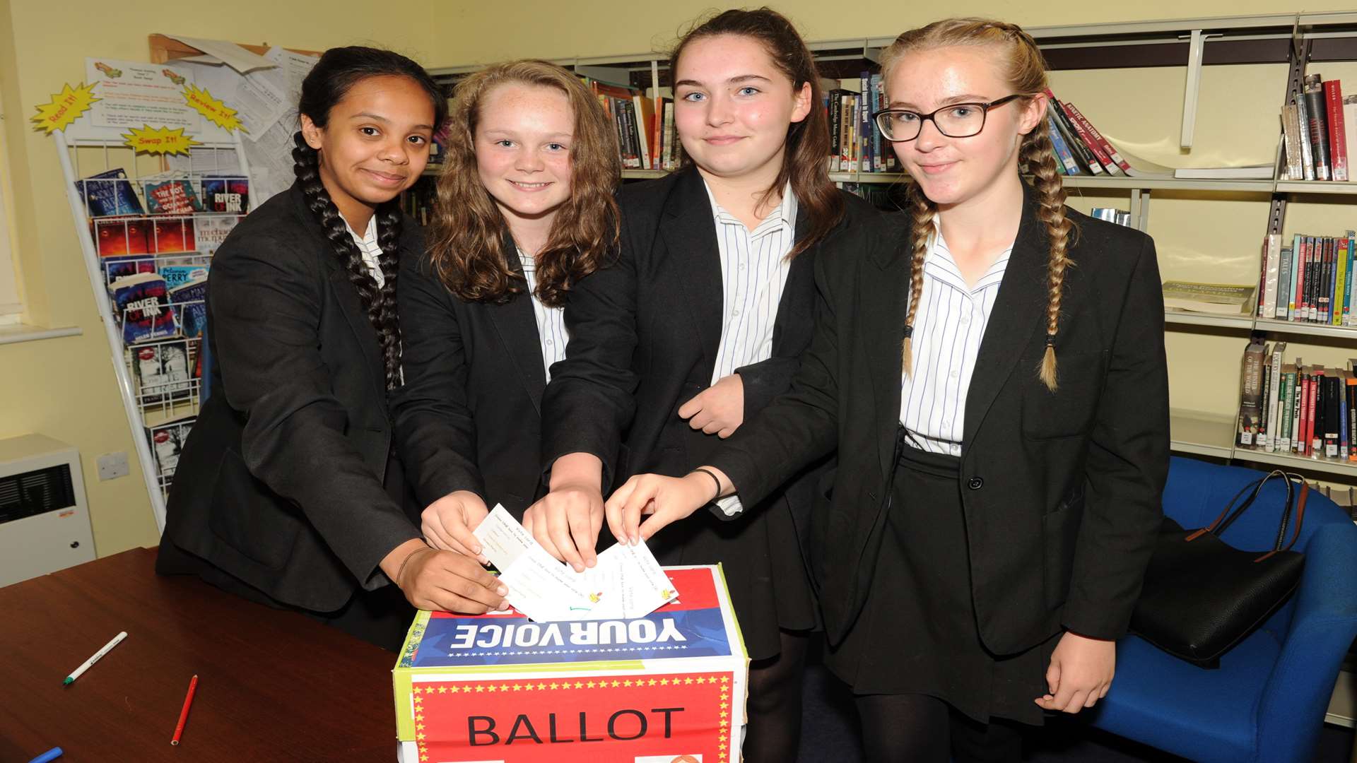 Emily Cayzer, 13, Abla Richard, 14, Zahra Hussain, 14, Emma Hager, 14, at the ballot box