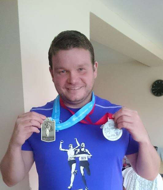 Andrew (Pandy) Warman with his medals from London and Brighton marathons