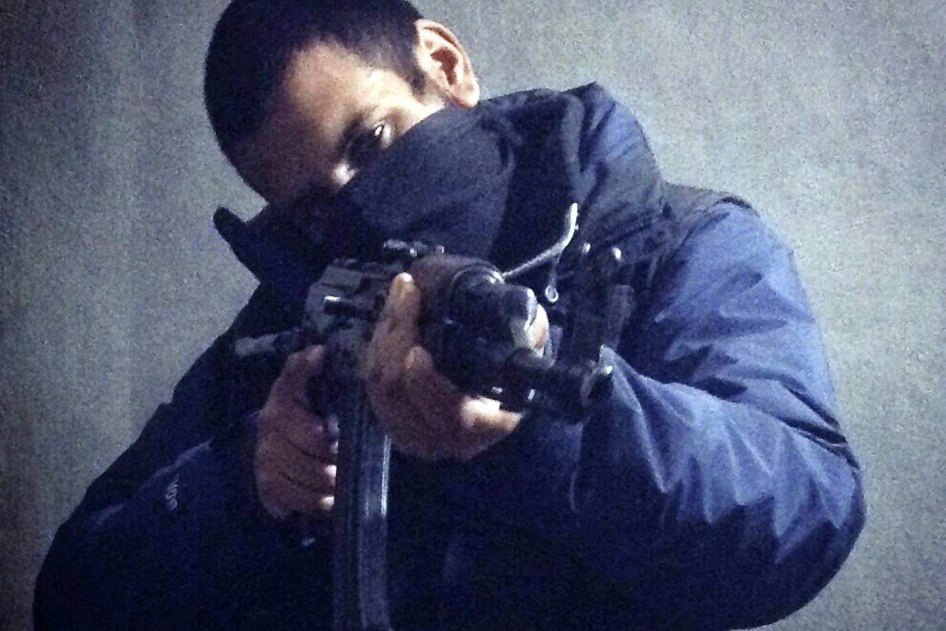 Computer hacker-turned jihadi Junaid Hussain pictured on Twitter with a rifle in his hands.