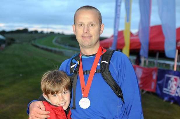 Craig Burns pictured at the finish line with his son, Aidan