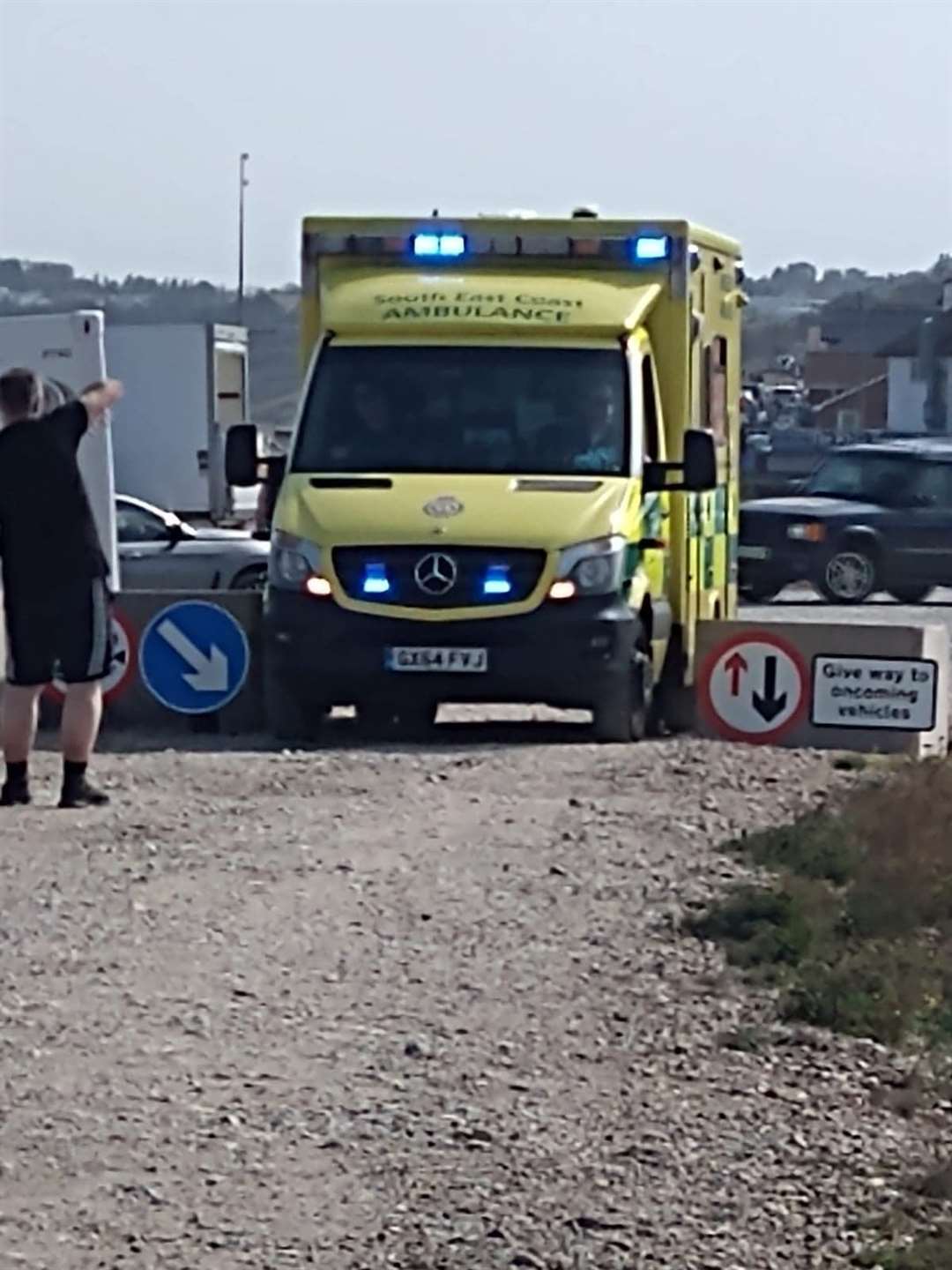An ambulance trying to squeeze through Swale council's concrete bollards on the shingle bank at Minster, Sheppey, during Sunday's emergency when a kite-surfer was seriously injured. Paramedics don't have keys to the emergency barrier at the other end of the beach. Picture: Gary Inge