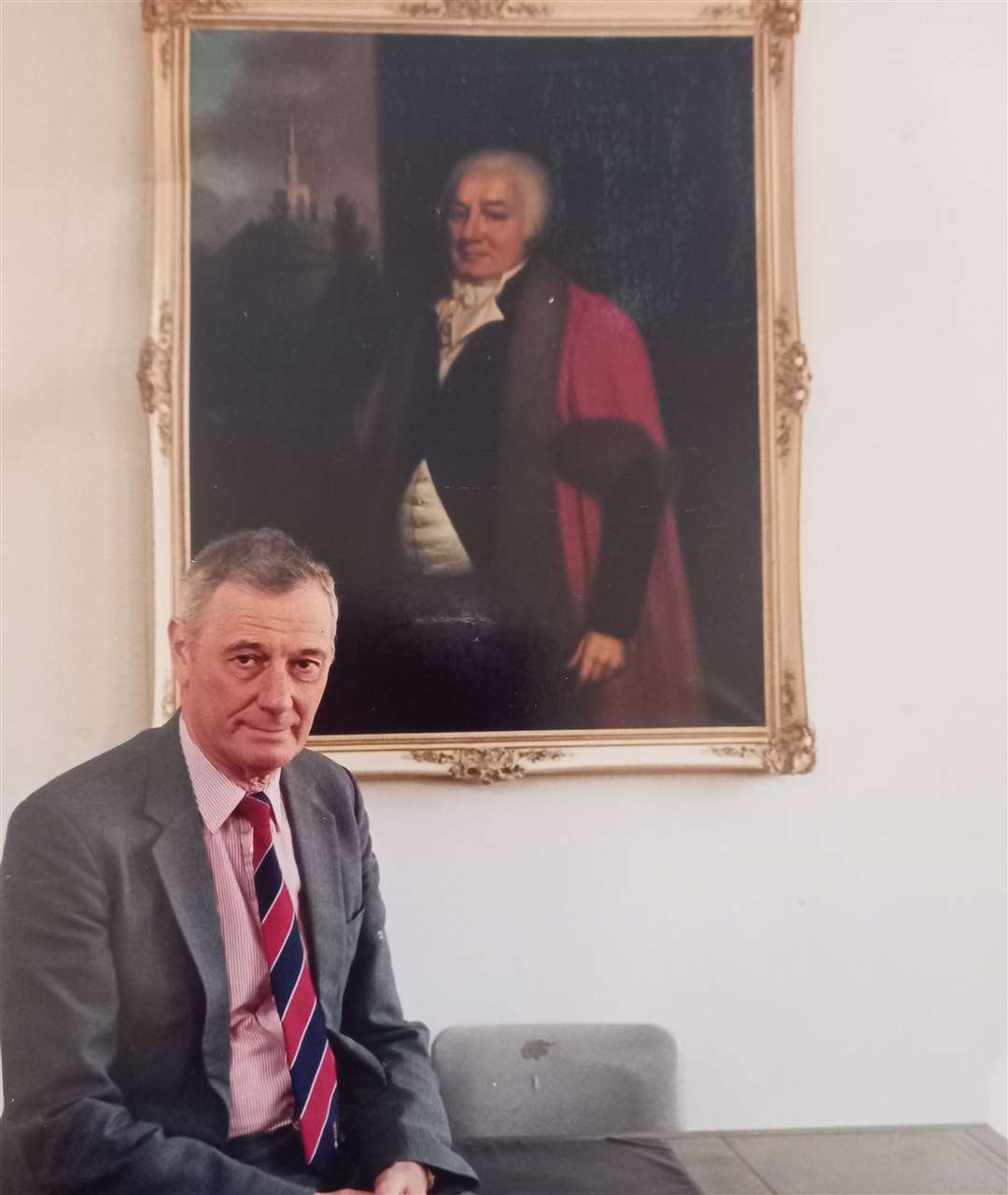 Former Kentish Gazette editor Alan Bensted with a portrait of newspaper's founder, James Simmons
