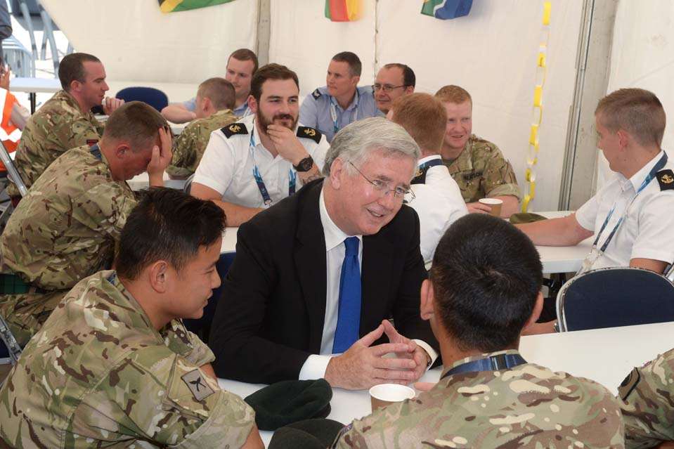 Defence Secretary Michael Fallon chatting to members of the military venue security force. Picture: Mark Owens