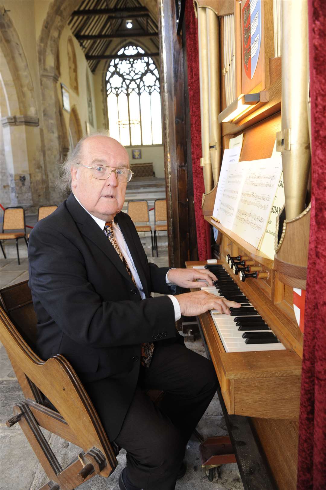 George Sharman plays the organ at the church