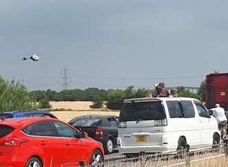 Kent Air Ambulance helicopter coming in to land at the Sheppey Crossing earlier today. Picture: Adam Yates