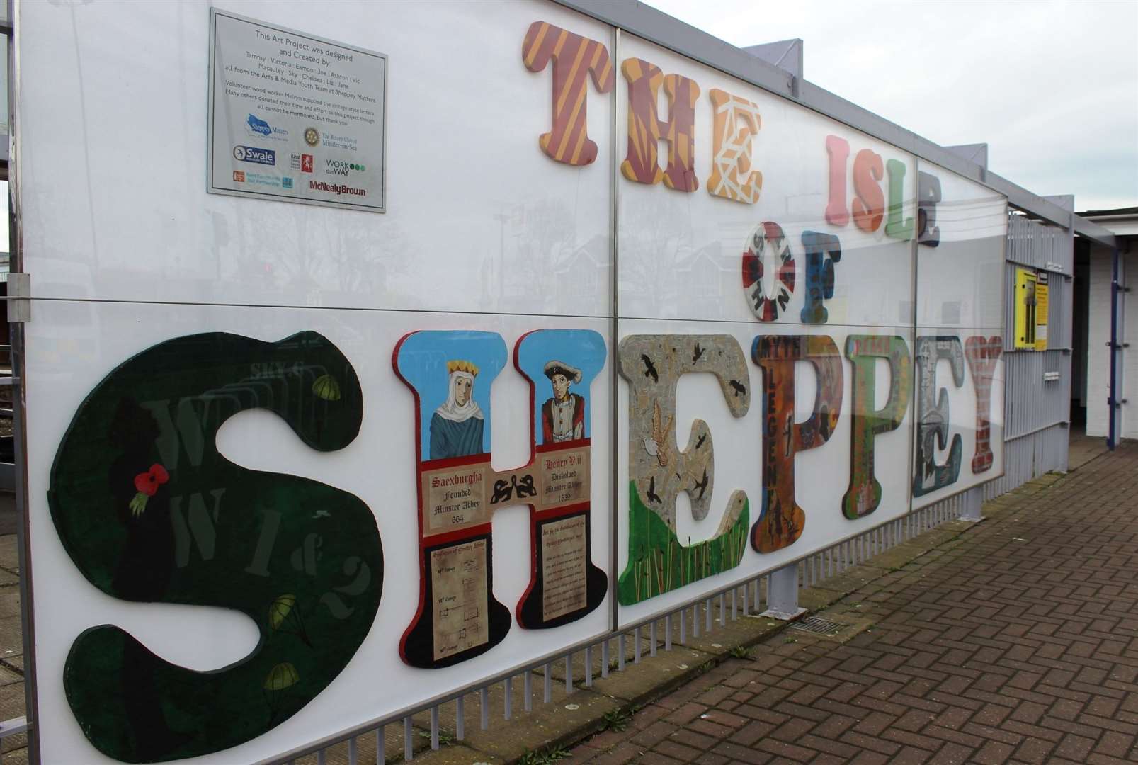 Conditions of Use: Slug: ST Shepsign 030317Caption: The Isle of Sheppey sign at Sheerness train station was officially "unveiled" by MP Gordon Henderson when he cut the ribbon on Friday (Mar 3)Location: SheernessCategory: Human InterestByline: John NurdenUploaded By: John NurdenCopyright: Blue Town Heritage CentreOriginal Caption: FM4697990 (10905118)