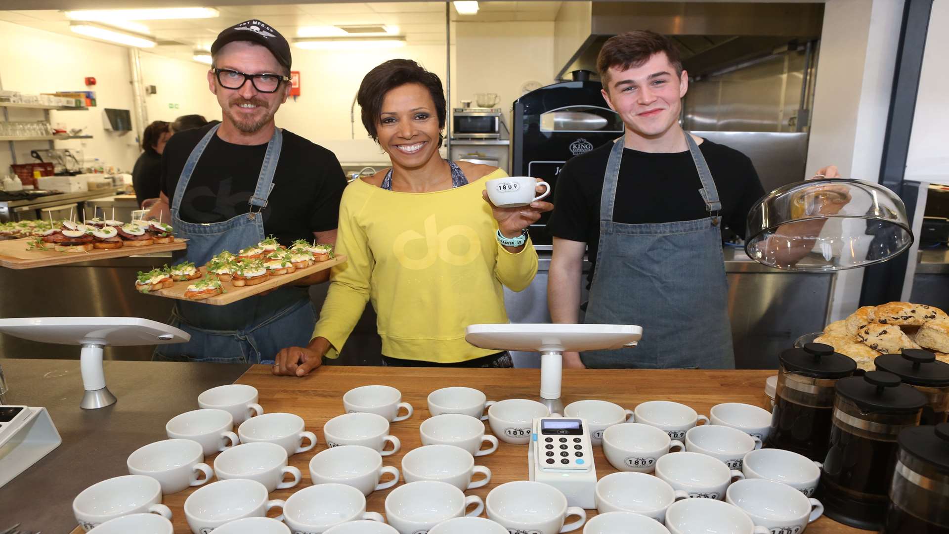 Dame Kelly Holmes with Shaun Fennings, Cafe 1809 Active operations manager, and Joe Drake, cafe assistant. Picture: John Westhrop