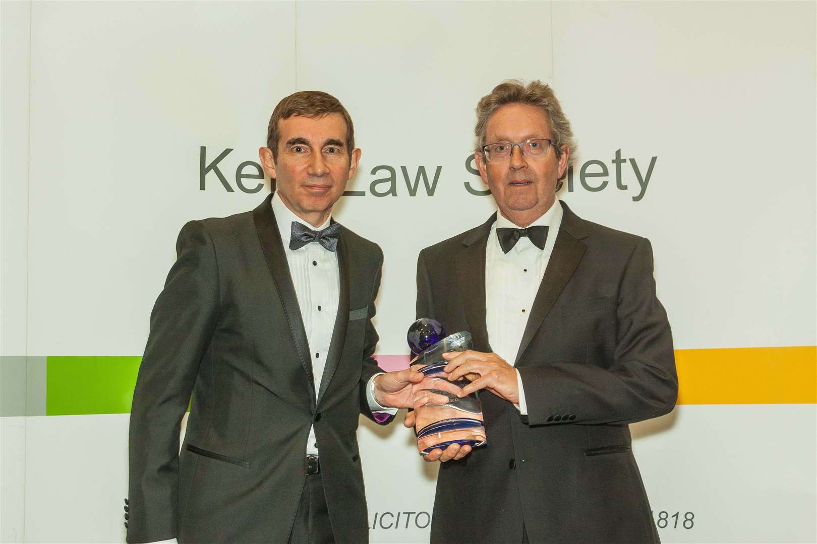 From left, McBrides Chartered Accountants managing partner Nick Paterno presents Blair Gulland with the outstanding achievement award