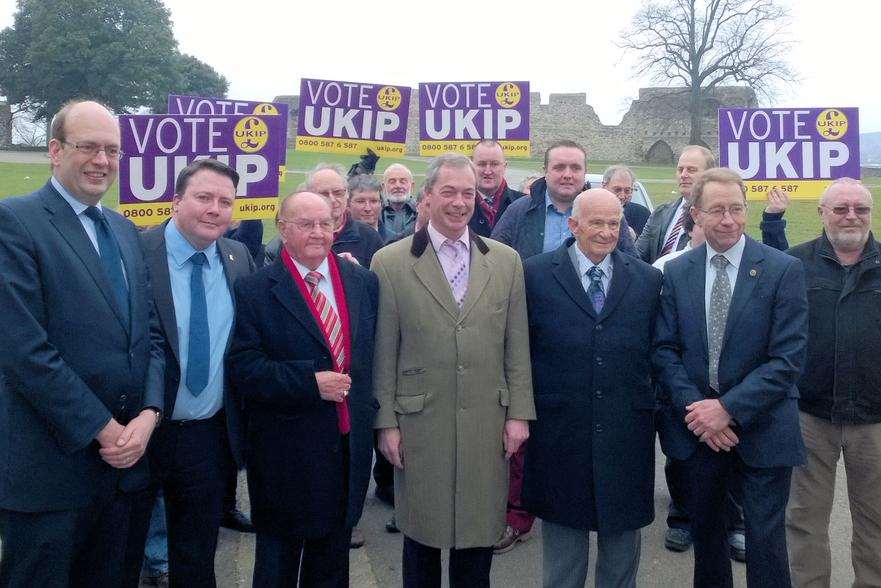 The Ukip leader at Rochester Castle gardens, welcoming Cllr Tom Mason and Cllr Vaughan Hewett to the party. Picture: Ukip.