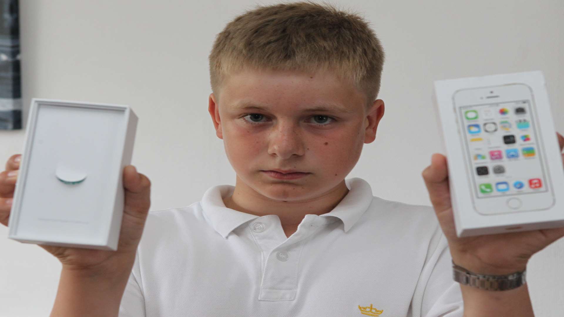 Michael Barnett, 13, with his empty iPhone box. Picture: John Westhrop