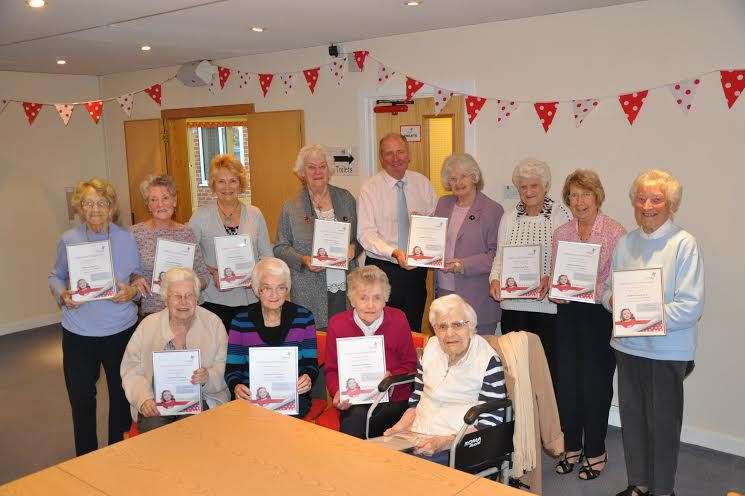Demelza's chief executive Steve Hoy (centre) presents members of the Sittingbourne Friends' Group with their certificates