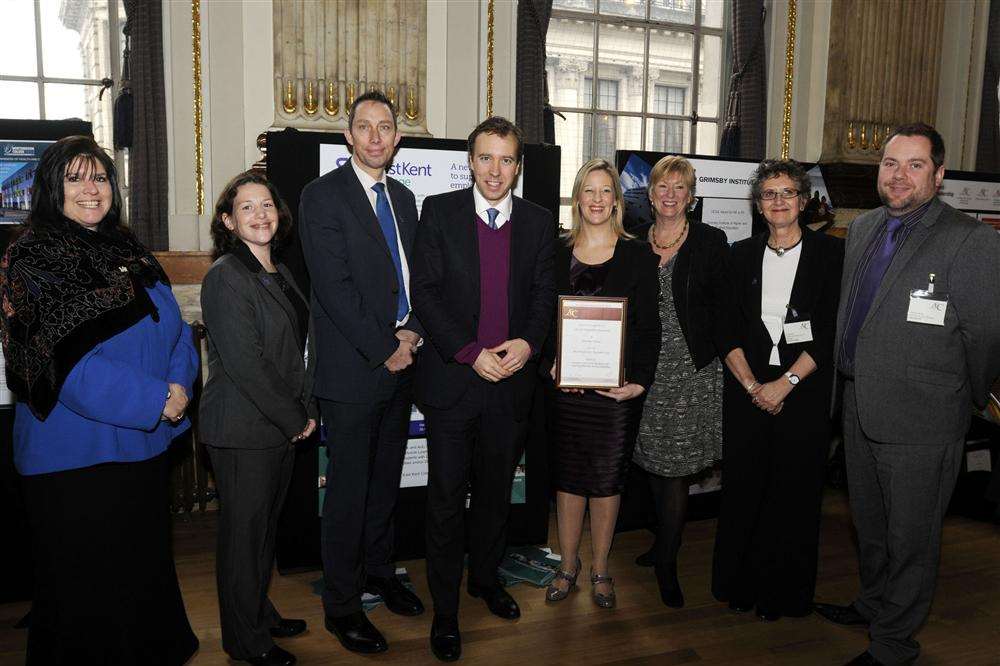Matthew Hancock MP (4th from left) presents the Beacon Award to East Kent College's (from left) Anne Leese, Helen Fagg, Graham Razey, Carly Tickner, Jane Jobey, Jo Campbell and Jonathan Rouse of sponsor Microlink. The award is national recognition for outstanding work done by the college with students with learning difficulties.