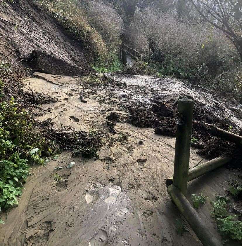 A mudslide was pictured on the Cow Path at Folkestone Leas in November last year. Part of it still remains closed off. Picture: James Butcher