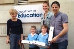 Kim Carter,Mary Rouse, Matt Green and children outside Department of Education